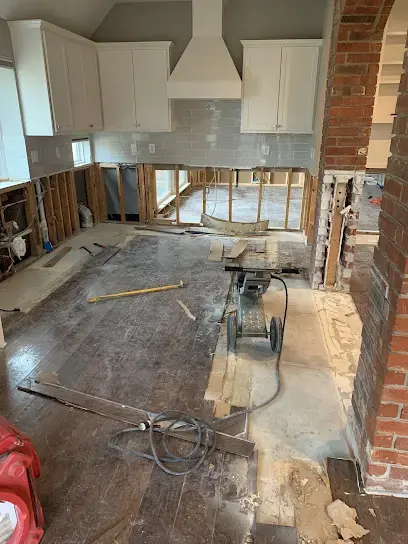 Kitchen with the cabinets and flooring opened up during a water damage dry-out